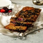 slices cut from pb & j banana bread on a white cloth