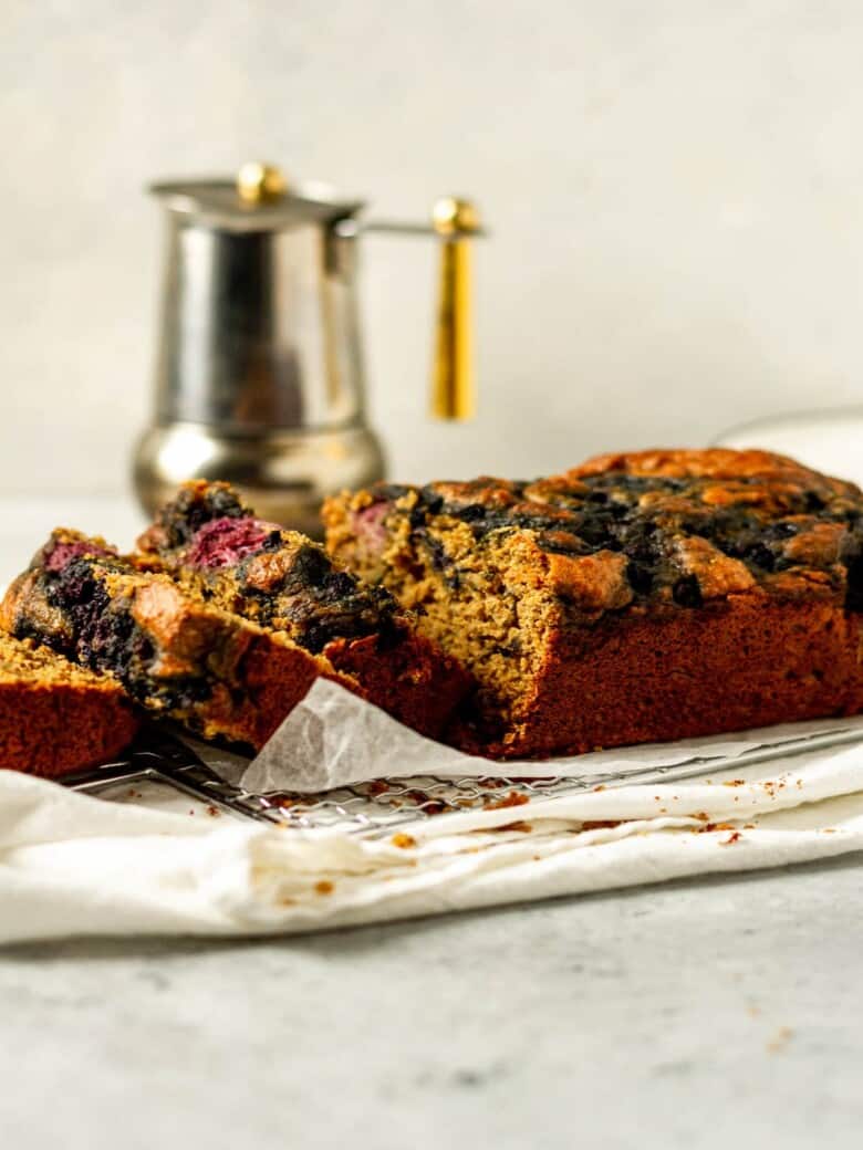Slices of pb & j banana bread on a white cloth.