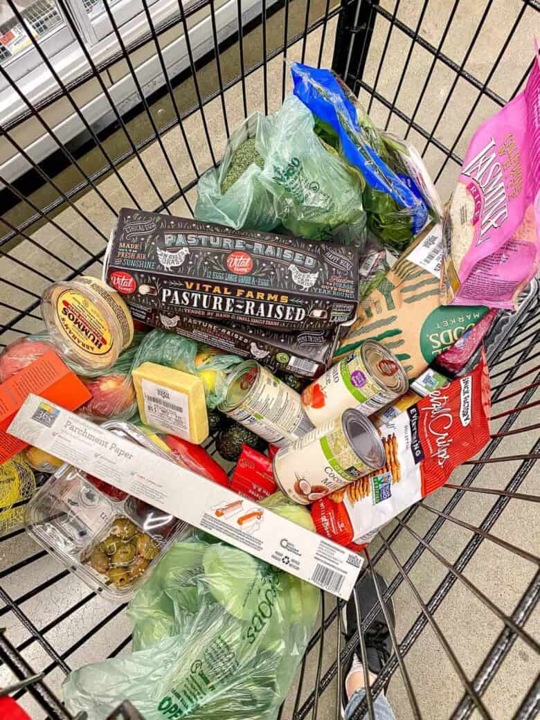 grocery cart full of food from Whole Foods Market after meal planning