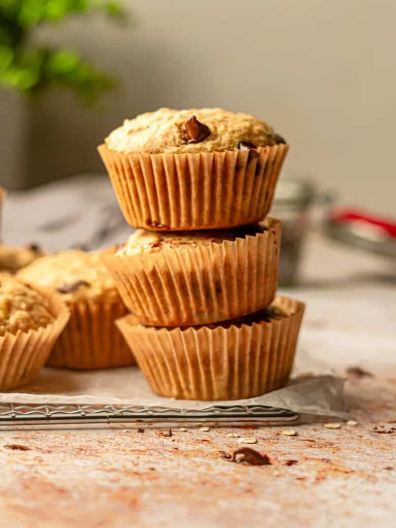 Three banana oatmeal muffins stacked.