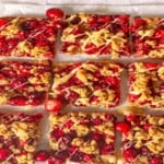 Crumble bars drizzled with white chocolate.