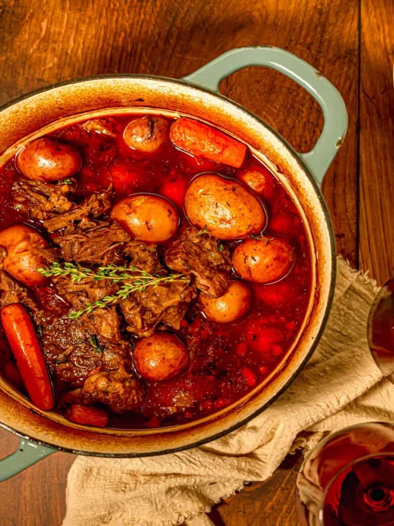 pot roast and potatoes in a dutch oven