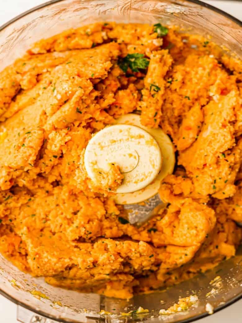 Food processor filled with salmon burger filling.