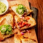 Quesadillas topped with salsa and guacamole.