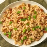 A white plate filled with kidney beans and rice.