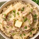Mashed potatoes with melted butter on top.