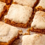 Sliced of cake frosted with vanilla frosting.