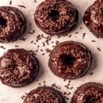 Chocolate donuts with chocolate sprinkles.