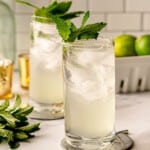 A cucumber mojito in a highball glass.