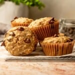 Oatmeal chocolate chip muffins on a cooling rack.