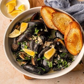 Garlic butter mussels in a bowl.