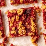 Raspberry oat square on parchment paper.