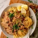 Spaghetti with chicken piccata in a bowl.