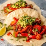 A fajita topped with guacamole.