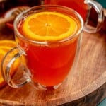 A warm cocktail in a clear mug.