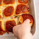 A hand picking up a slider.