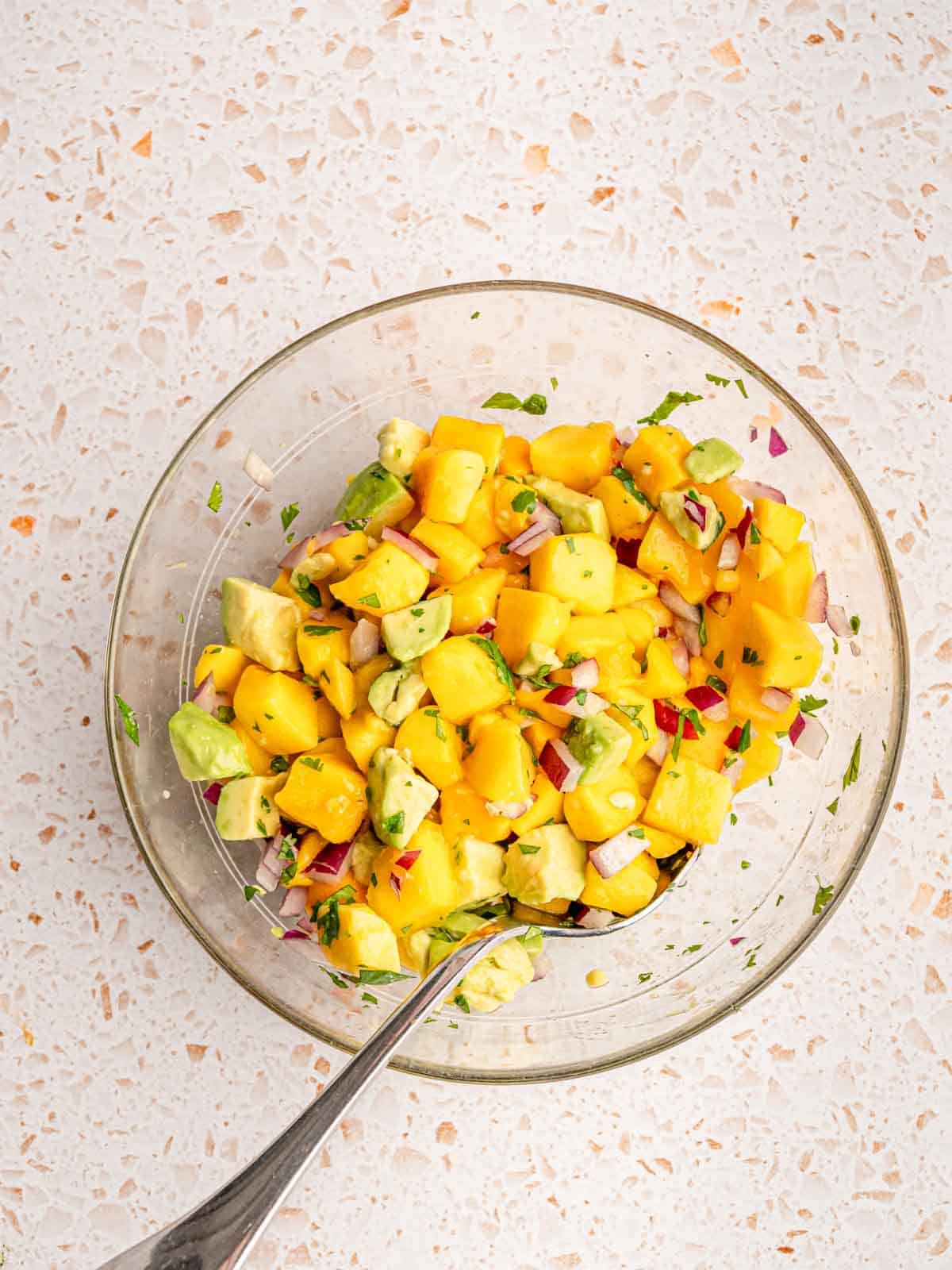 Mango and avocado salsa in a bowl.