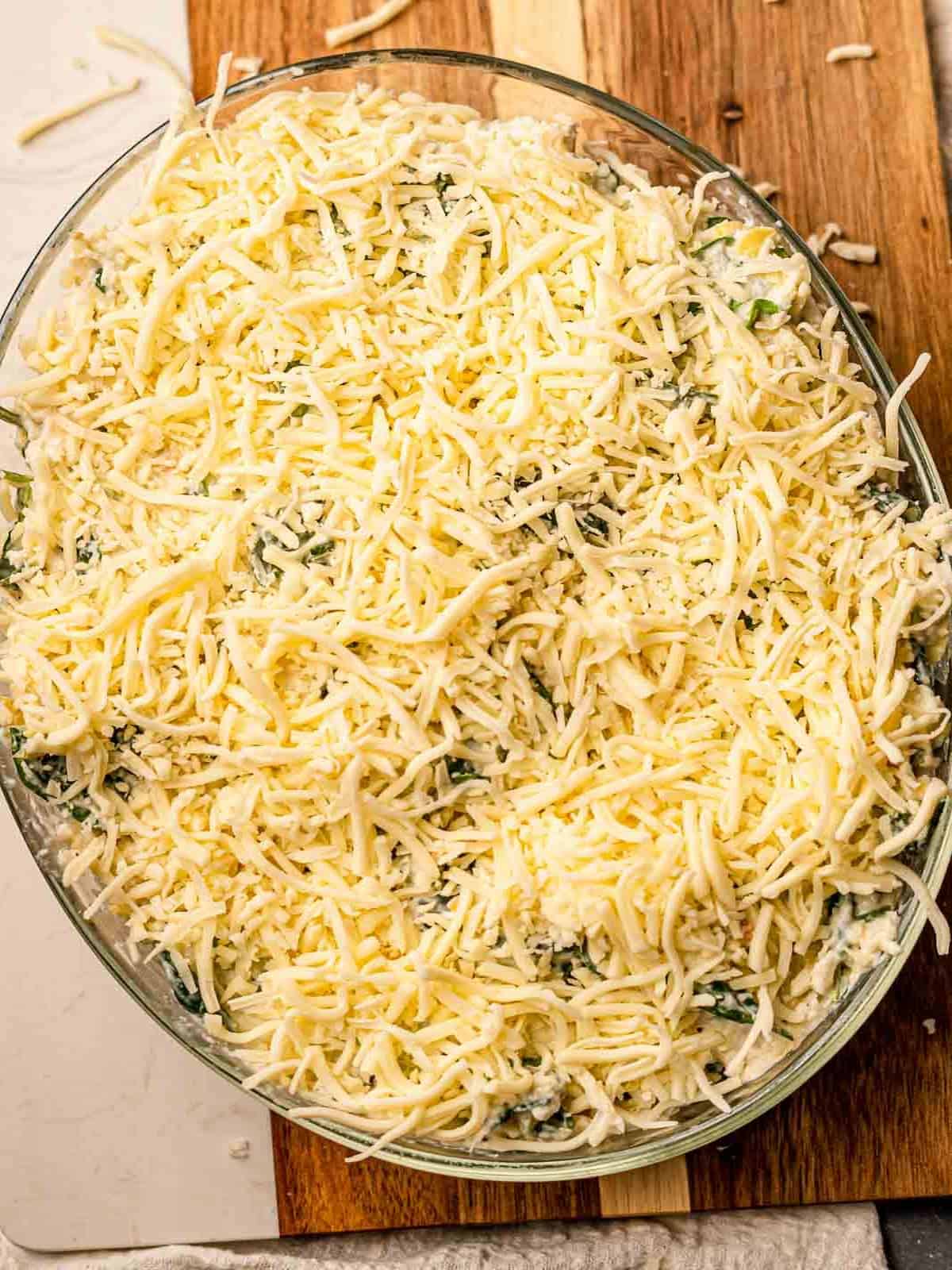 Cheese on top of a dip before baking.