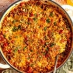 Stuffed pepper skillet with a spoon digging in.