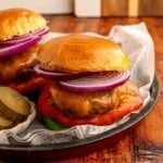 Cheeseburgers on a plate.