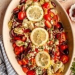 Baked Greek salmon in a baking dish.
