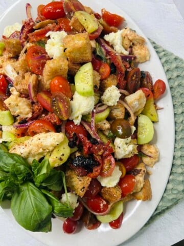 Bread and vegetable salad, mozzarella, tomatoes, basil.