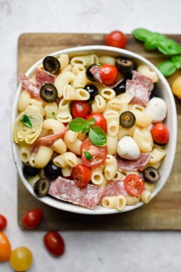 Antipasto pasta salad in a white bowl.