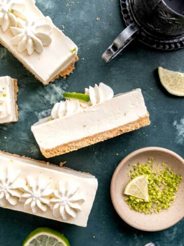 White cheesecake bars with lime zest.