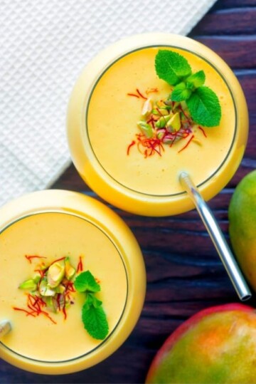 Mango lassis topped with mint.