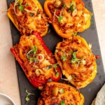 Stuffed peppers topped with microgreens.