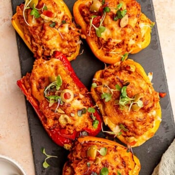Stuffed peppers topped with microgreens.