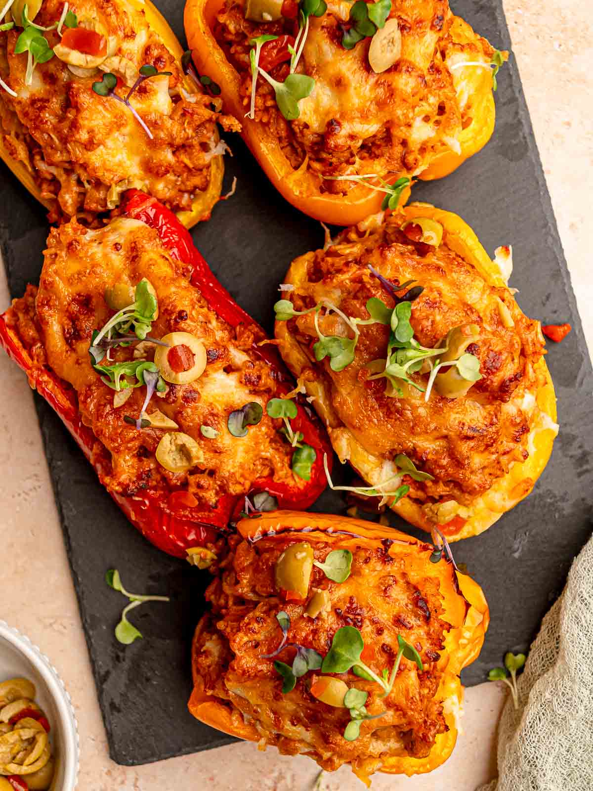 Bell peppers stuffed with pork and rice.