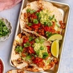 Tacos with salsa and guacamole.