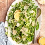 Spinach and arugula salad topped with shaved parmesan.