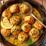 A spoon serving chicken piccata meatballs.