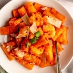 Shrimp pasta with vodka sauce in a bowl.