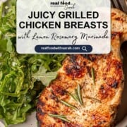 Pinterest image featuring juicy grilled chicken breast garnished with rosemary and served with fresh arugula salad. Text overlay reads “Juicy Grilled Chicken Breasts with Lemon Rosemary Marinade” and includes the Real Food with Sarah logo and website URL.