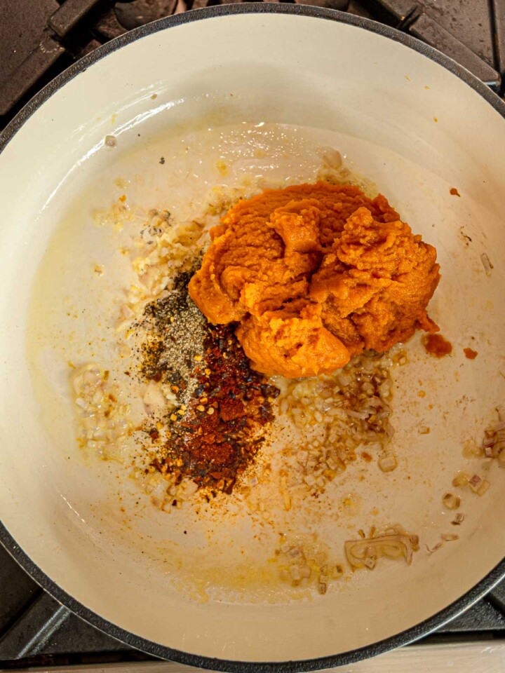 Pumpkin puree with paprika, black pepper, and red pepper flakes added to sautéed shallots and garlic.