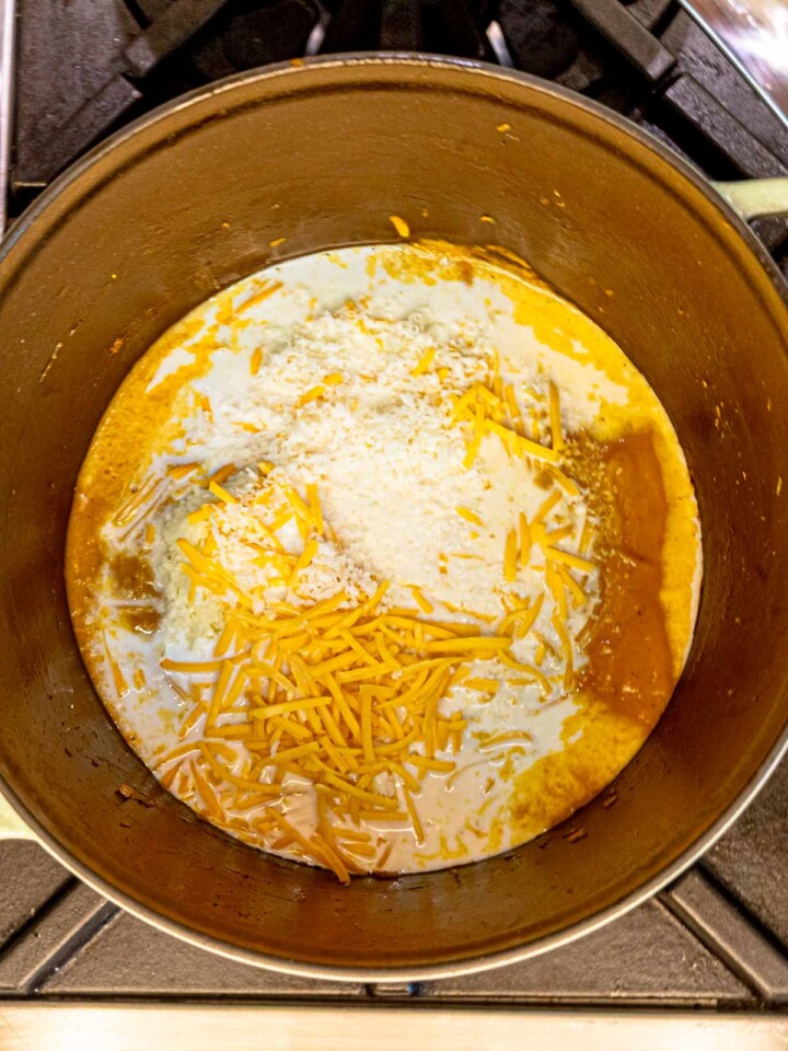 Milk and shredded cheese added to the butternut squash sauce mixture.