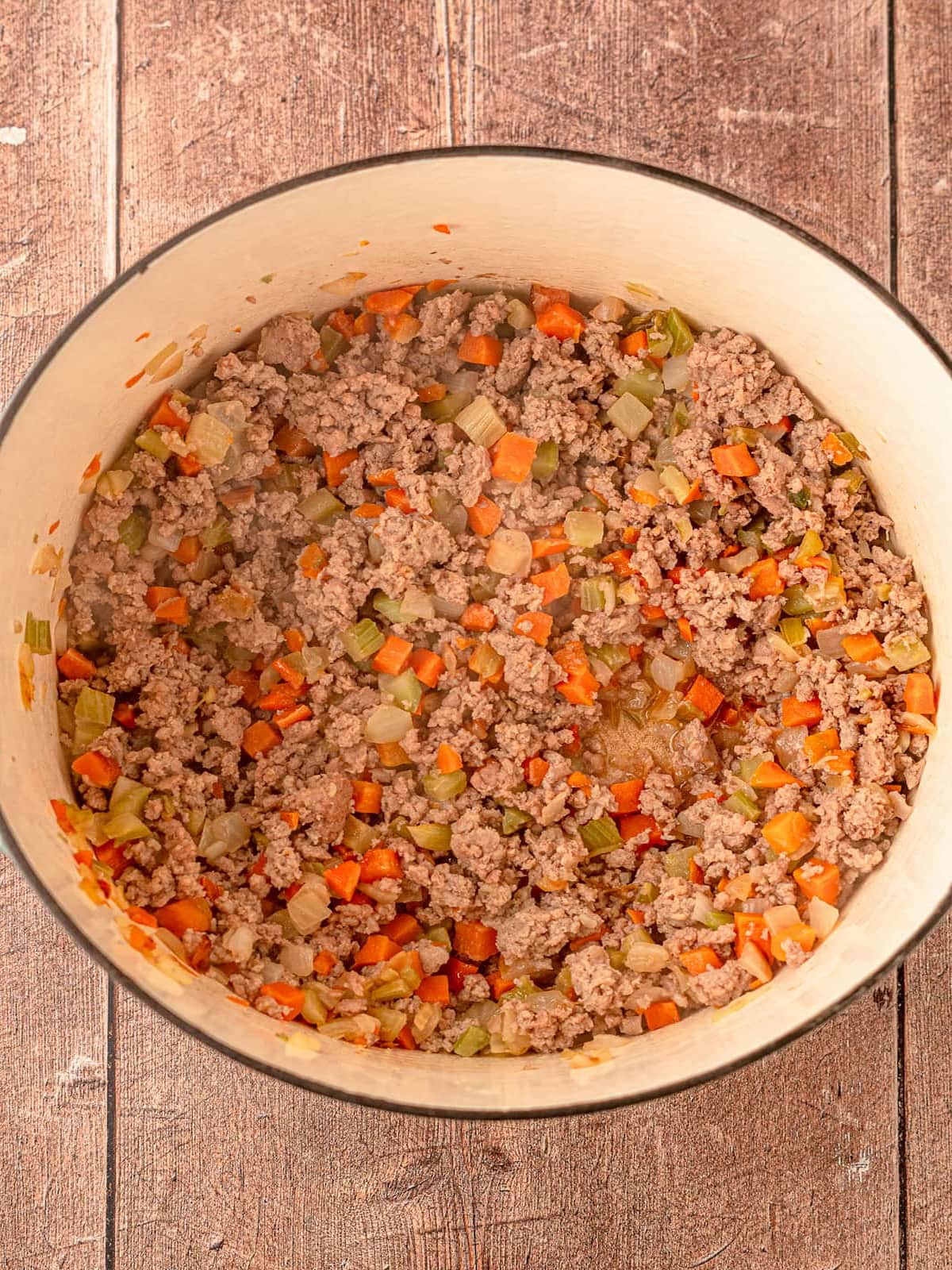 Ground turkey and veggies cooking in a pot.