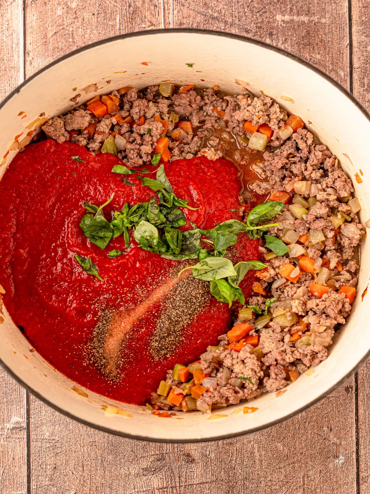 Bolognese ingredients in a pot.