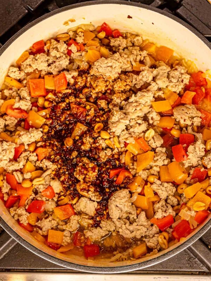 Ground chicken stir fry in the pan sauce poured over the center.