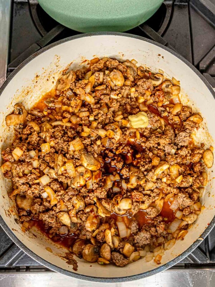 Worcestershire sauce, Dijon mustard, and white wine stirred into a skillet.