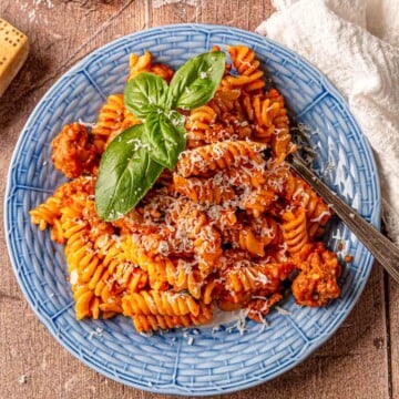 Creamy roasted red pepper pasta with sausage ready.