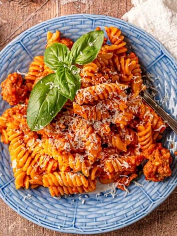 Creamy roasted red pepper pasta with sausage ready.