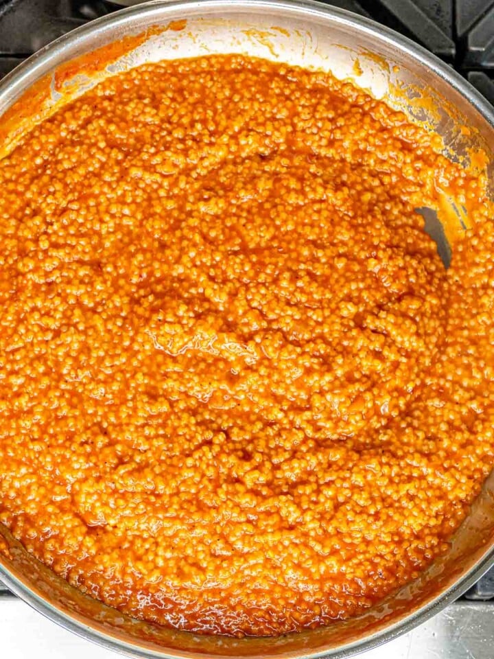 Creamy tomato pastina stirred together in the skillet.