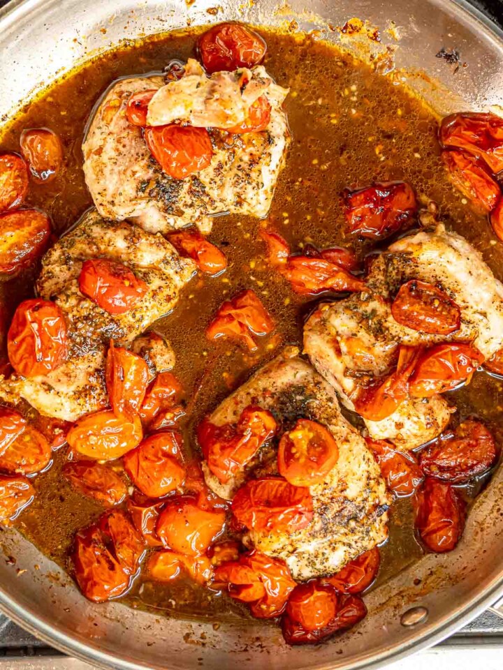 Chicken and tomatoes in glossy balsamic sauce before adding mozzarella.