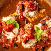 Balsamic caprese chicken topped with melted mozzarella, roasted tomatoes, and fresh basil.