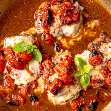 Balsamic caprese chicken topped with melted mozzarella, roasted tomatoes, and fresh basil.