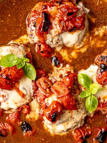 Balsamic caprese chicken topped with melted mozzarella, roasted tomatoes, and fresh basil.